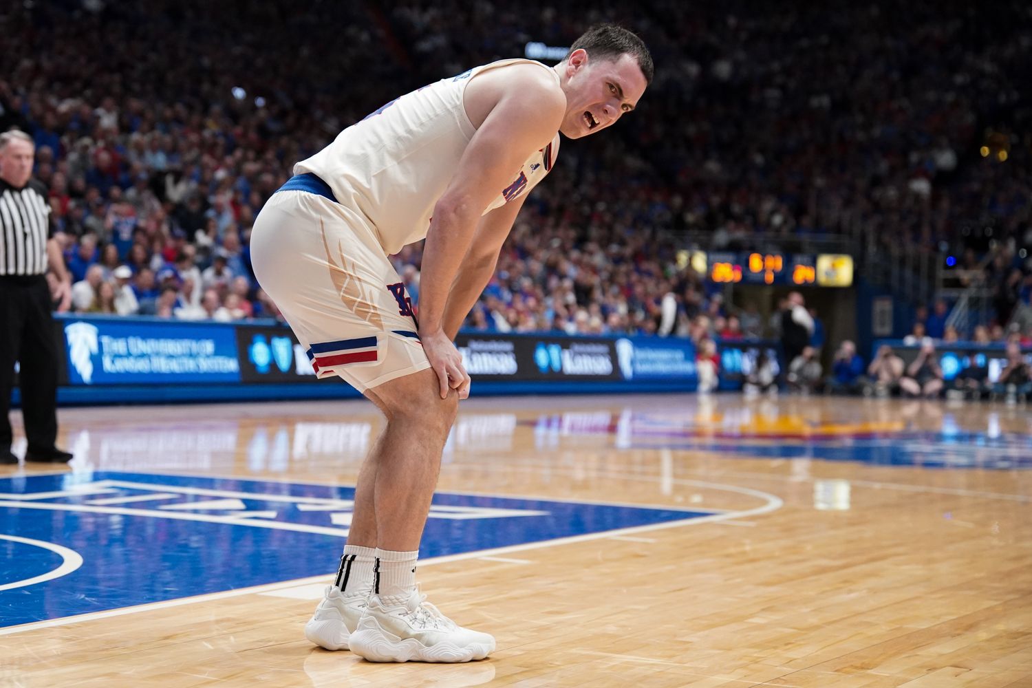 Feb 27, 2024; Lawrence, Kansas, USA; Kansas Jayhawks guard Nicolas Timberlake (25) grimaces after an injury against the Brigham Young Cougars during the first half at Allen Fieldhouse. Mandatory Credit: Denny Medley-USA TODAY Sports  